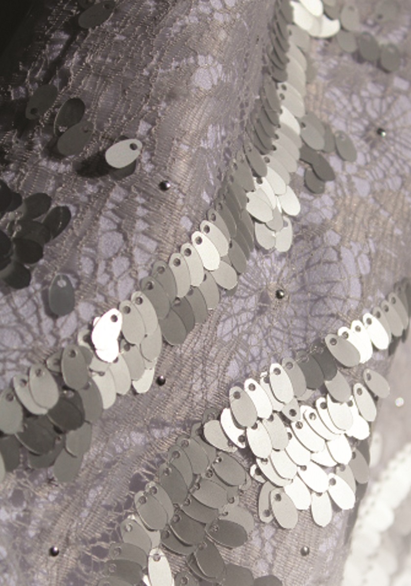 An image of a silver sequined dress created by Gundula Hirn of Gundula Couture.
