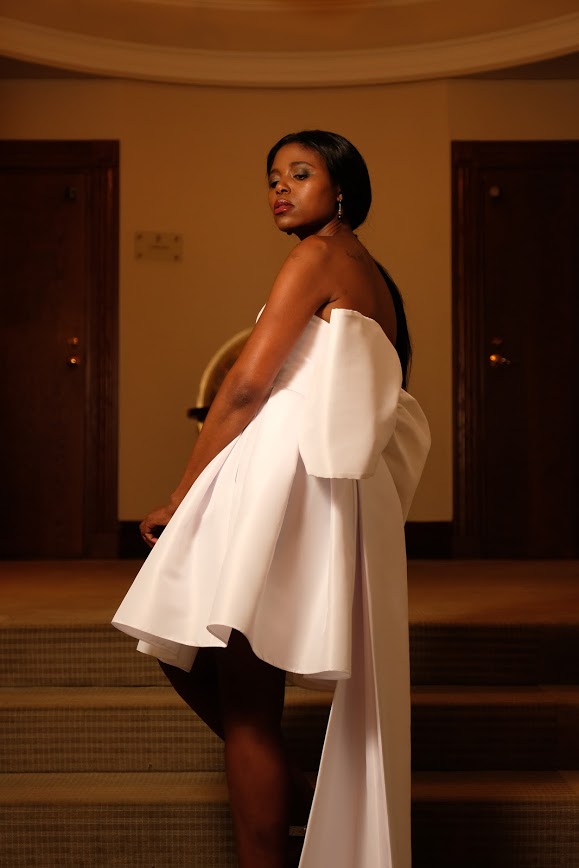 An image of a gown with bow train by Gundula Hirn of Gundula Couture.